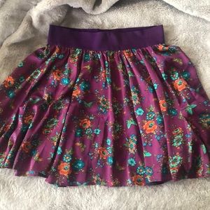 Purple patterned silk circle skirt.
